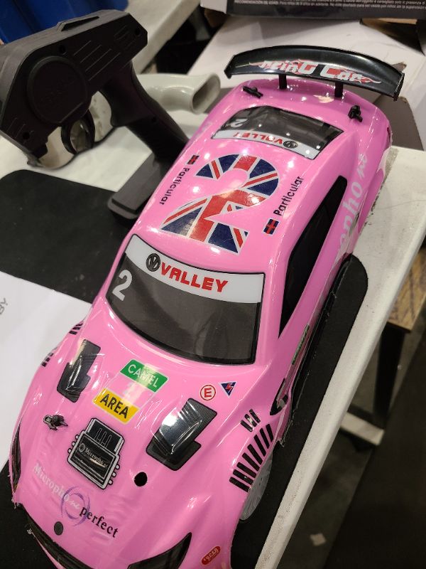 Photo 1 of RACENT RC Drift Car - 1:14 Scale 4WD 15MPH Fasr Remote Control Toy for Boys Kids Adults with Drifting & Racing Tires, 2 Rechargeable Batteries (Pink)