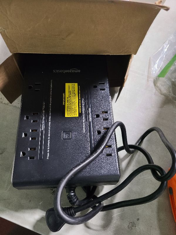 Photo 1 of Amazon Basics UPS Battery Backup & Surge Protector 600VA/360W, 8 Outlets, Standby Uninterruptible Power Supply, for Power Outage Protection, Compact, Black