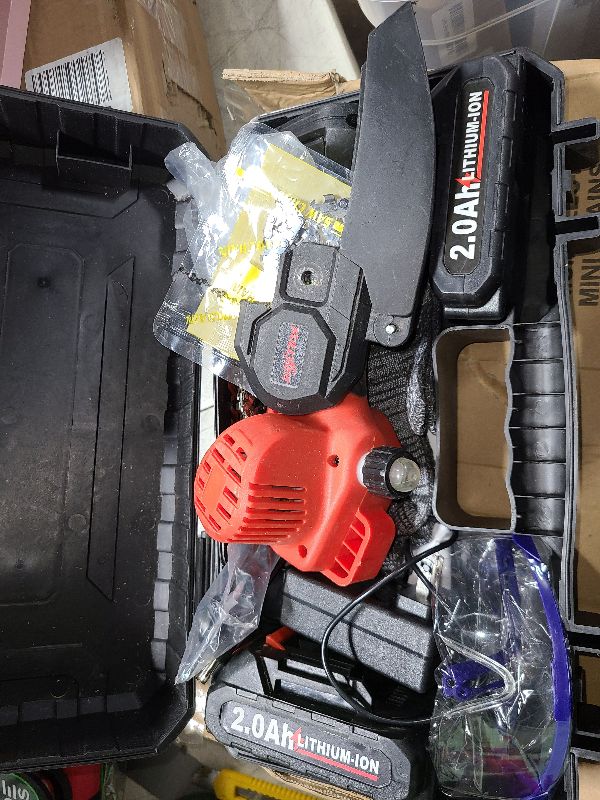 Photo 1 of Mini Chainsaw Cordless, 6 Inch Portable Electric Chainsaw, One-Hand Handheld Small Chain Saw for Cutting Wood Trimming and Woodworking- Mini Chain Saw Battery Powered with 2 Batteries