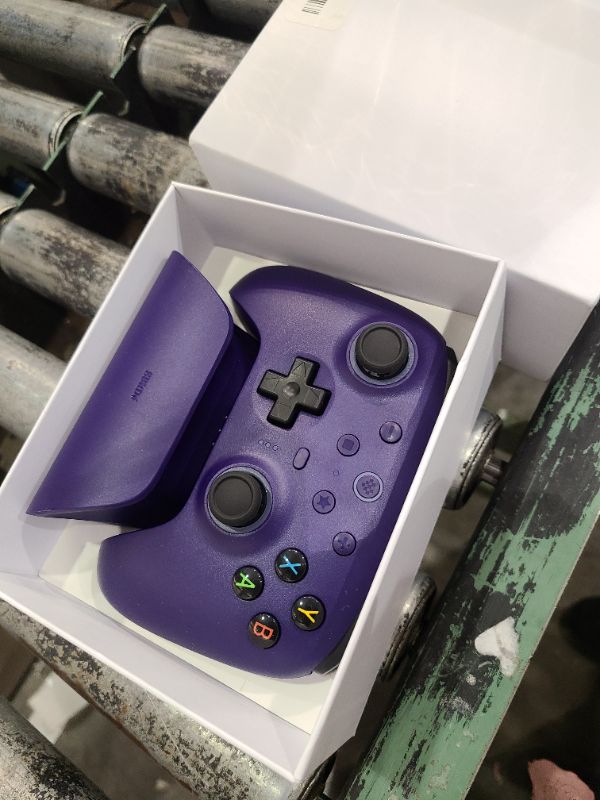 Photo 1 of 8BitDo Ultimate 2 Wireless Controller with TMR Joysticks for Windows & Android, Gaming Controller with Switchable Hall Effect/Tactile Triggers, RGB Fire Ring, 8Speed Wireless Tech, Charging Dock, Purple