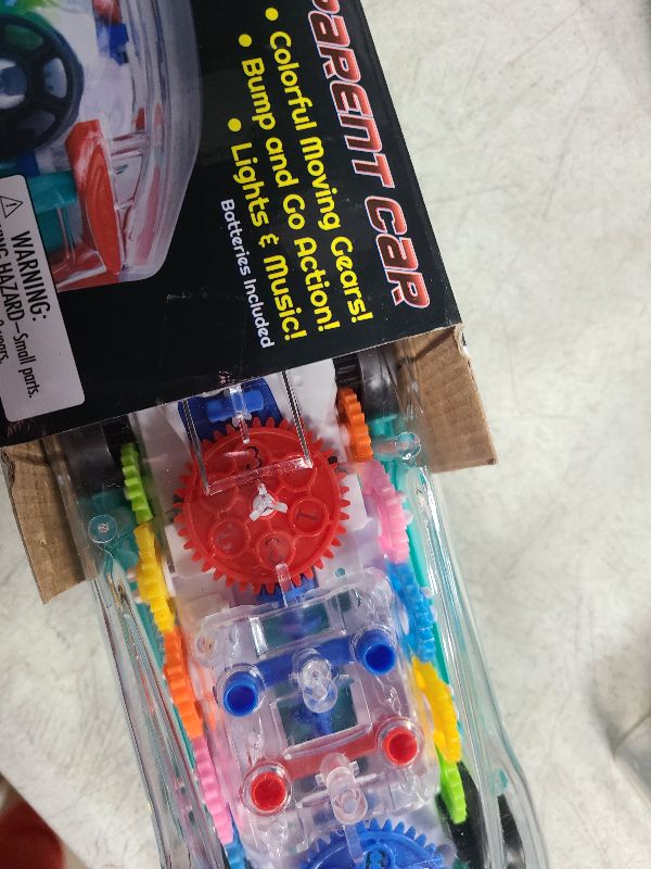 Photo 1 of ArtCreativity Light Up Transparent Sensory Car Toy for Kids, 1PC, Bump and Go Toy Car with Colorful Moving Gears, Music, and LED Effects, Easter Toys for Toddlers, Great Birthday Gift Idea