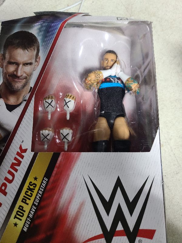 Photo 1 of **PACKAGING IS DAMAGED**
Mattel WWE Top Picks Elite Action Figure & Accessories Set, CM Punk 6-inch Collectible with Swappable Hands, Ring Gear & 25 Articulation Points