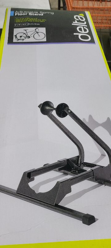 Photo 1 of  Adjustable Spring Floor Stand 