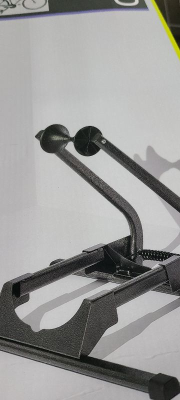 Photo 1 of  Adjustable Spring Floor Stand 