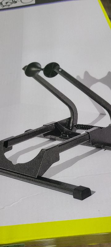 Photo 1 of  Adjustable Spring Floor Stand 