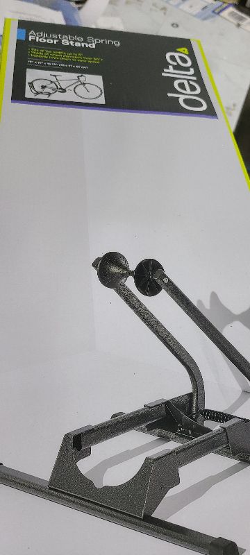 Photo 1 of  Adjustable Spring Floor Stand