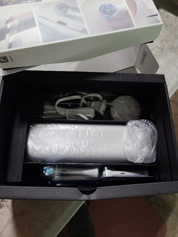 Photo 1 of Oral-B iO Series 8 Electric Toothbrush with 2 Replacement Brush Heads and Travel Case, Rechargeable Toothbrush, Whitealabaster