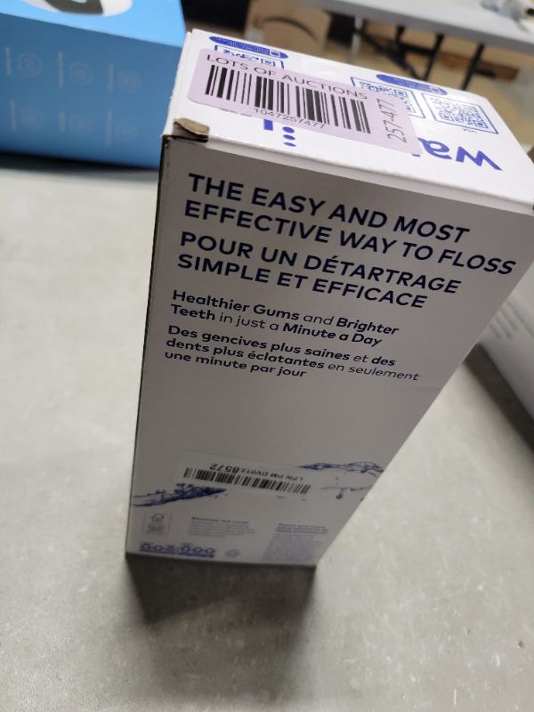 Photo 1 of Waterpik Cordless Pulse Rechargeable Portable Water Flosser for Teeth, Gums, Braces Care and Travel with 2 Flossing Tips, Waterproof, ADA Accepted, WF-20 White, Packaging May Vary