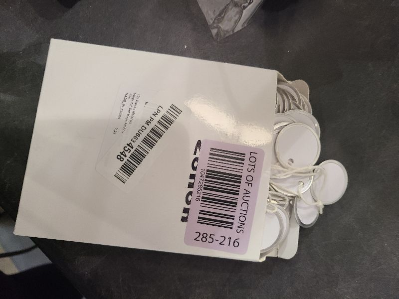 Photo 1 of 100 Pieces Metal Rim White Key Tags Bulk 1.2 Inches Round Blank Paper Tags with Knotted Strings Attached for Car and Door Keys