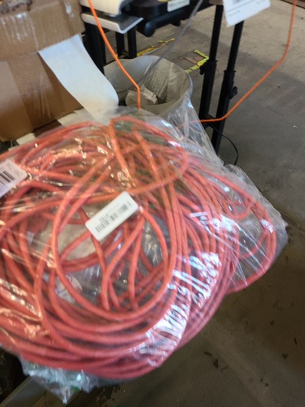 Photo 1 of Amazon Basics Heavy Duty 100 foot 3-Prong Vinyl Indoor/Outdoor Extension Cord - 10 Amps, 1250 Watts, 125 VAC - Orange