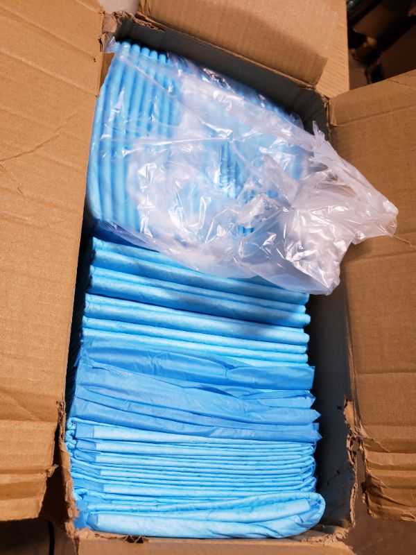 Photo 1 of Amazon Basics Leakproof, Absorbent, Disposable Puppy Pads for Potty Training, Heavy Duty Absorbency, Regular Size, 24 x 23 Inches, Pack of 50, Blue & White