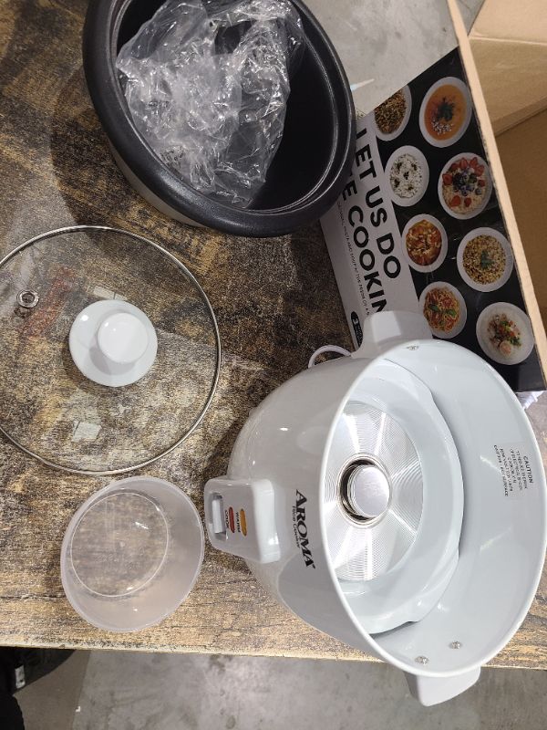 Photo 1 of Aroma Housewares Aroma 6-cup (cooked) 1.5 Qt. One Touch Rice Cooker, White (ARC-363NG), 6 cup cooked/ 3 cup uncook/ 1.5 Qt.
small dent on bowl