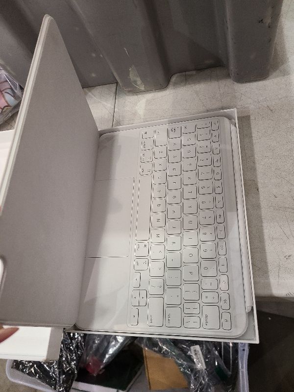 Photo 1 of Apple Magic Keyboard Folio: iPad Keyboard and case for iPad (A16 and 10th Generation), Detachable Two-Piece Design That attaches magnetically, Built-in trackpad, US English – White