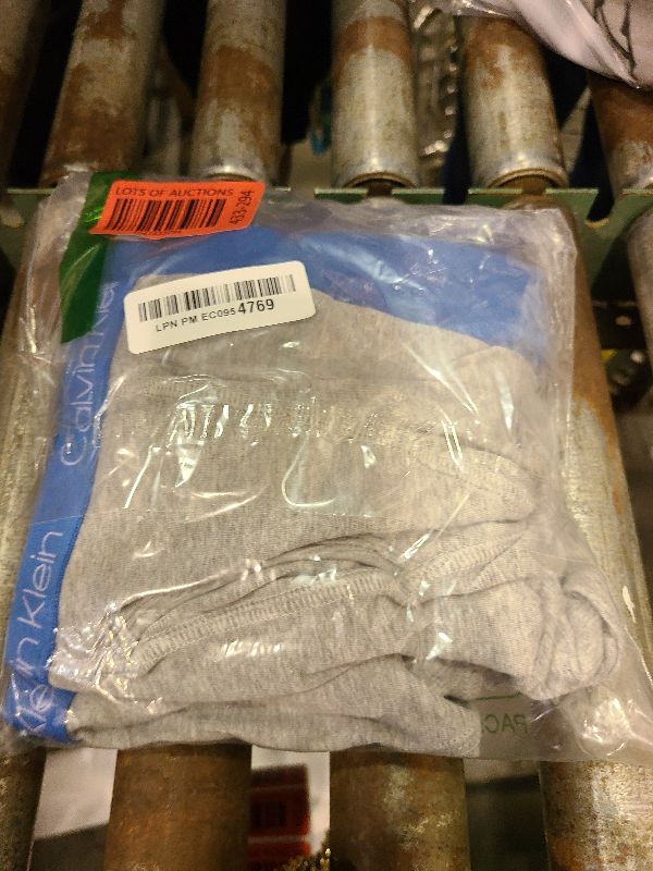 Photo 1 of  Calvin Klein Boys' Underwear Four Pack Boxer Brief Value Pack 
Color: Marlin/Heather Grey/Camo/French Blue
Size: Large 12/14