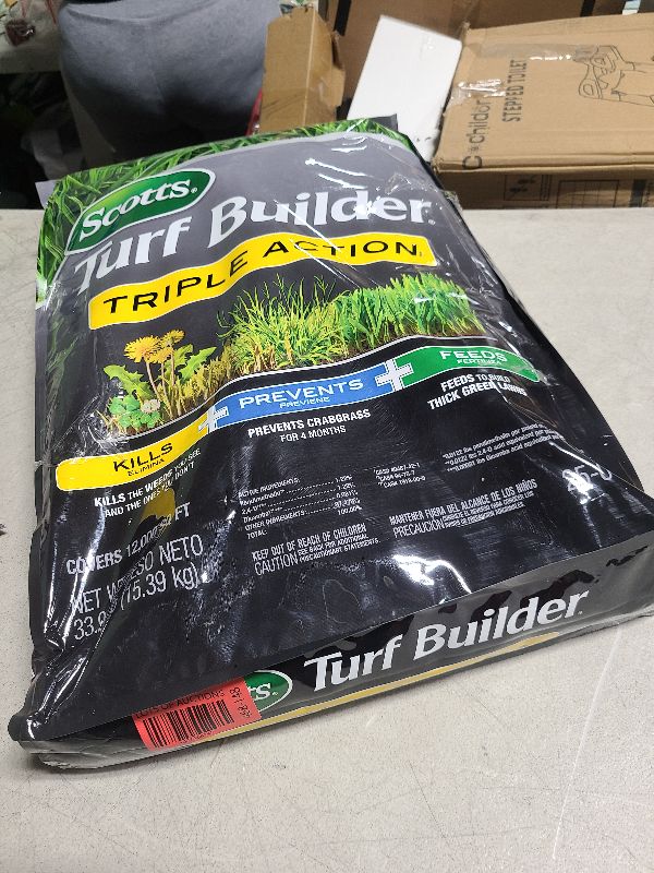 Photo 1 of Scotts Turf Builder Triple Action1 - Combination Weed Control, Weed Preventer, and Fertilizer, 33.94 lbs., 12,000 sq. ft.