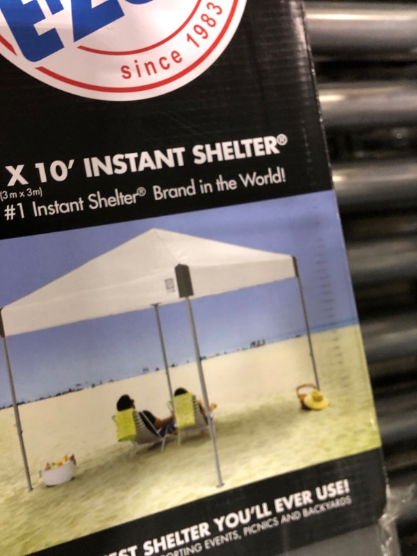 Photo 1 of ***MISSING TARP***

E-Z UP Ambassador Instant Pop Up Canopy Tent, 10' x 10', Roller Bag and 4 Piece Spike Set, Slate White