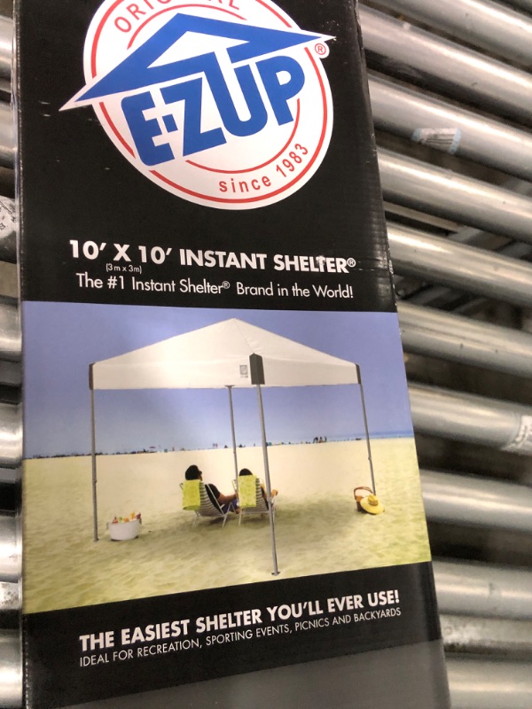Photo 1 of ***FRAME ONLY***

E-Z UP Ambassador Instant Pop Up Canopy Tent, 10' x 10', Roller Bag and 4 Piece Spike Set, Slate White