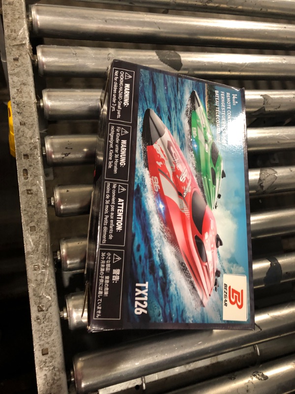 Photo 1 of **FOR PARTS/ MISSING A BATTERY** BEZGAR RC Boat, 12 inch Remote Control Boat for Kids and Adults, 25 KPH Fast RC Speed Boats with 700mAh Battery, Ideal Waterproof Toy Boats for Lakes & Pools - TX126 Red