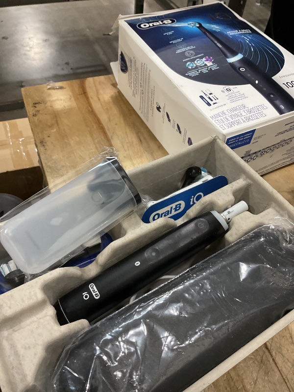 Photo 1 of ***(PARTS ONLY/ MAJOR DAMAGE/ NON FUNCTIONAL)***Oral-B iO Deep Clean + Whiten Rechargeable Electric Toothbrush with Visible Pressure Sensor, 2 Minute Timer, 5 Cleaning Settings, 1 iO5 Limited, 3 Toothbrush Heads, Travel Case & Refill Holder, Black