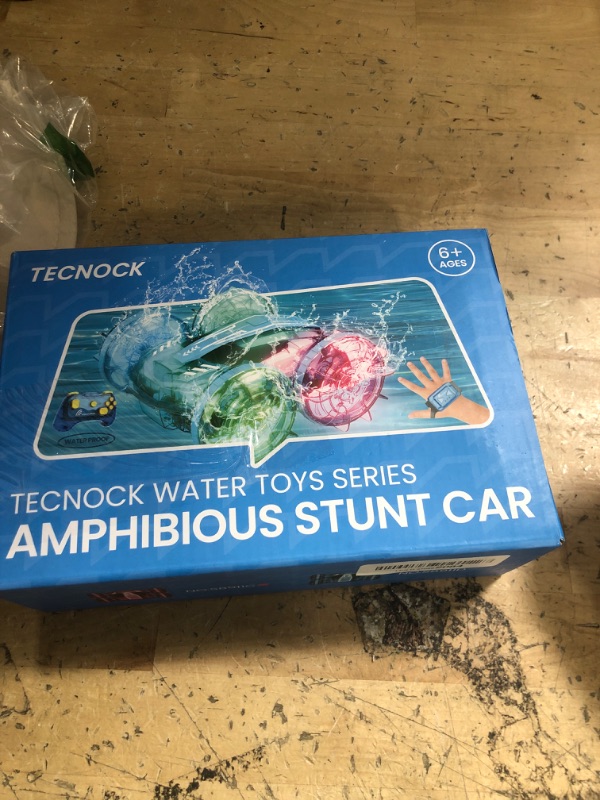 Photo 1 of ***(PARTS ONLY/ MAJOR DAMAGE/ NON FUNCTIONAL)***Tecnock Amphibious Remote Control Car Boat for Kids, 4WD RC Cars with Waterproof Remote, 2.4GHz RC Boat with LED Lights, 60 Minutes of Playtime, Water Pool Toys Gifts for Boys and Girls