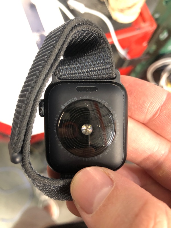 Photo 1 of (HEAVILY WORN) (LOCKED) Apple Watch SE (2nd Gen) [GPS 40mm] Smartwatch with Midnight Aluminum Case with Ink Sport Loop One Size. Fitness and Sleep Trackers, Crash Detection, Heart Rate Monitor, Carbon Neutral