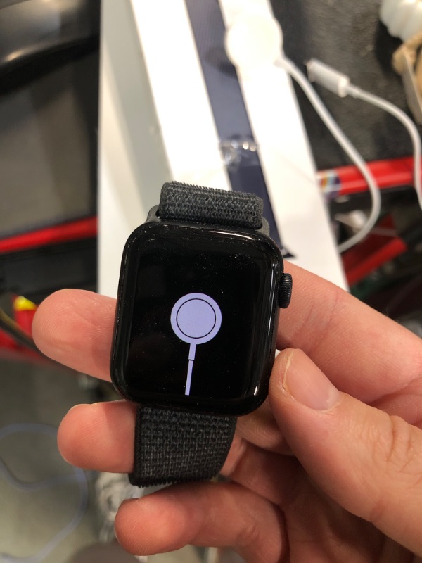 Photo 1 of (HEAVILY WORN) (LOCKED) Apple Watch SE (2nd Gen) [GPS 40mm] Smartwatch with Midnight Aluminum Case with Ink Sport Loop One Size. Fitness and Sleep Trackers, Crash Detection, Heart Rate Monitor, Carbon Neutral