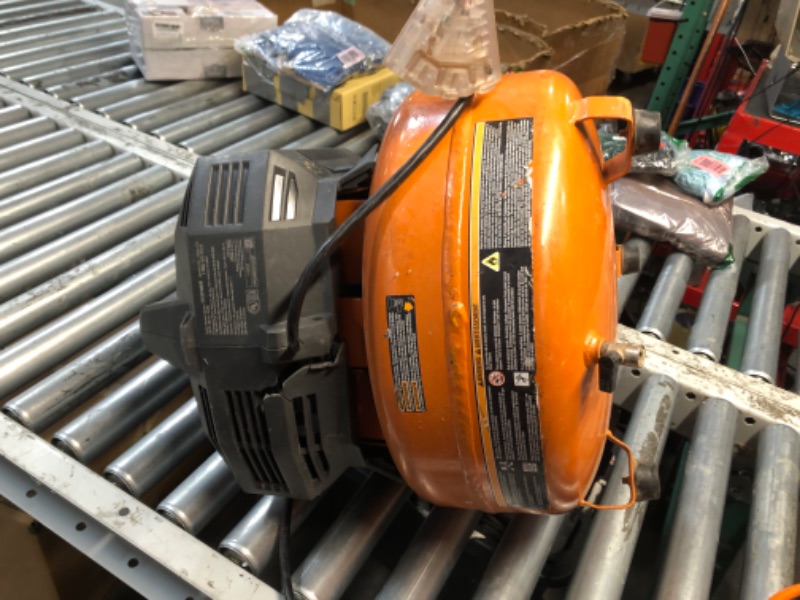Photo 1 of *** PARTS ONLY *** RIDGID 6 Gal. 150 PSI Portable Electric Oil-Free Jobsite Pancake Air Compressor with 25 ft. Air Hose and 18GA Brad Nailer 02106416A