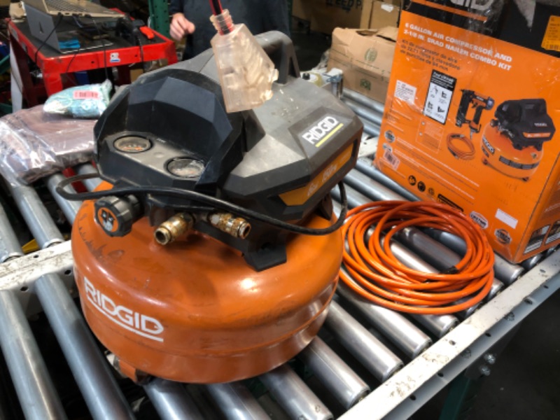 Photo 1 of *** PARTS ONLY *** RIDGID 6 Gal. 150 PSI Portable Electric Oil-Free Jobsite Pancake Air Compressor with 25 ft. Air Hose and 18GA Brad Nailer 02106416A