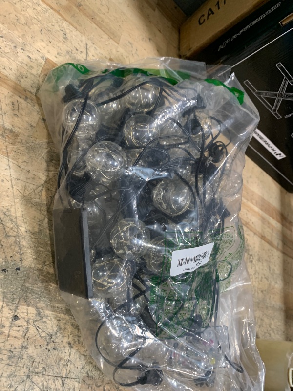 Photo 1 of **WIRES ARE TANGLED** Ollny Outdoor Lights 30FT 30Bulbs, RGBW Color Changing String Light, Plug in Remote Waterproof Shatterproof Timers G40 Patio Lights for Outside Balcony Porch Camping Deck Yard