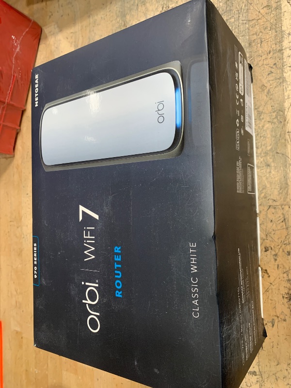 Photo 1 of ***(HEAVILY USED/ MINOR DAMAGE/ SEE NOTES BEFORE BIDDING)***NETGEAR Orbi 970 Series Quad-Band WiFi 7 Router (RBE971S), Security Features, Covers Up to 3,300 sq. ft., 200 Devices, 10 Gig Internet Port, Expandable to Create A Mesh System, BE27000 (Up to 27G