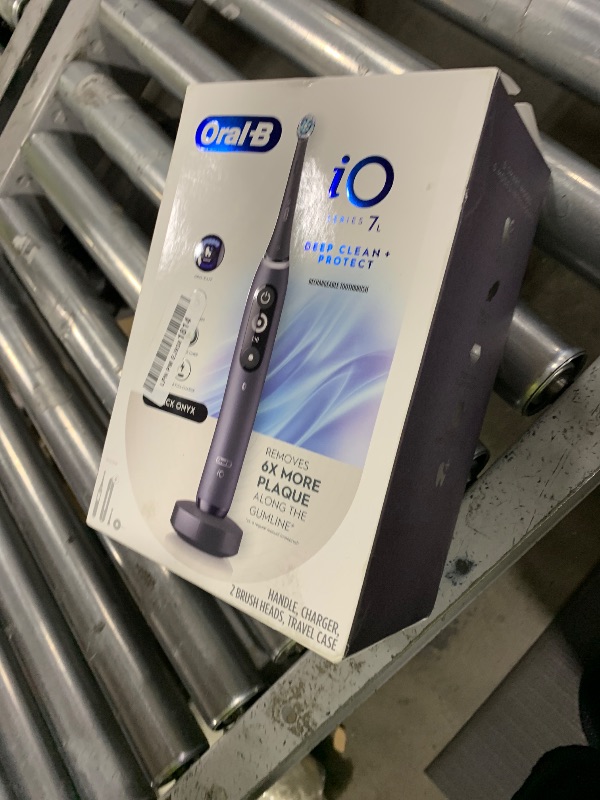 Photo 1 of Oral-B iO Deep Clean + Protect Rechargeable Electric Toothbrush, Black with a iO Series 7 Toothbrush, 2 Replacement Brush Heads, and a Charging Travel Case