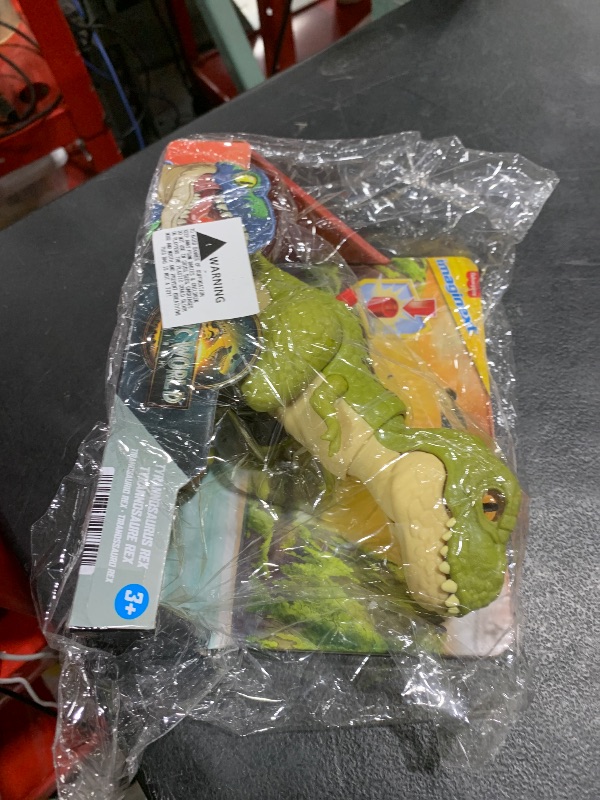 Photo 1 of Fisher-Price Imaginext Jurassic World Dinosaur Action Figure with Kid-Activated Motion, 8-inch Tyrannosaurus Rex Dino Toy