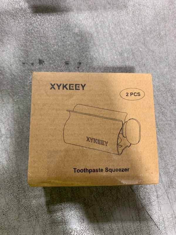 Photo 1 of XYKEEY Set of 2 Toothpaste Squeezer Rollers, Metal Toothpaste Tube Wringer Seat Holder Stand (Stainless Steel)