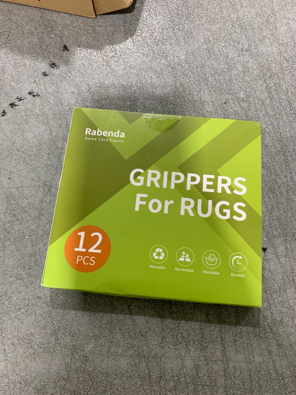 Photo 1 of Rabenda 12 Pcs Rug Tape, Non Slip Rug Pads Grippers for Hardwood Floors and Tiles, Reusable Carpet Tape for Area Rugs, Double-Sided Adhesive Rug Stickers Keep Corners Flat (Black)