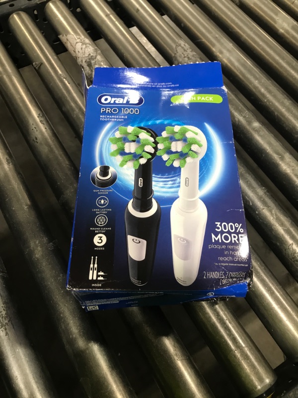 Photo 1 of Oral-B Pro 1000 CrossAction Electric Toothbrush, Black and White, 2 Count