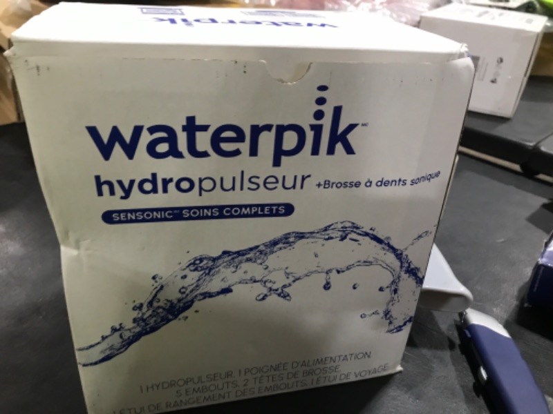 Photo 1 of Waterpik Sensonic Complete Care Water Flosser and Rechargeable Electric Toothbrush Combo Set for Teeth Cleaning and Flossing, CC-04, White, Packaging May Vary