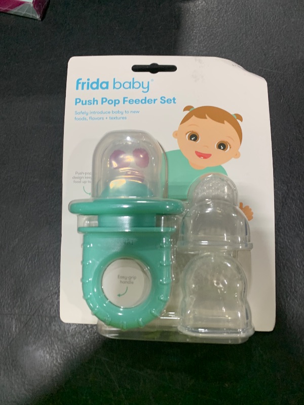 Photo 1 of Frida Baby Push Pop Feeder, Baby Fruit Food Feeder to Safely Introduce New Foods, Fresh + Frozen, Silicone, BPA Free, Dishwasher Safe | 3 Count, Teal
