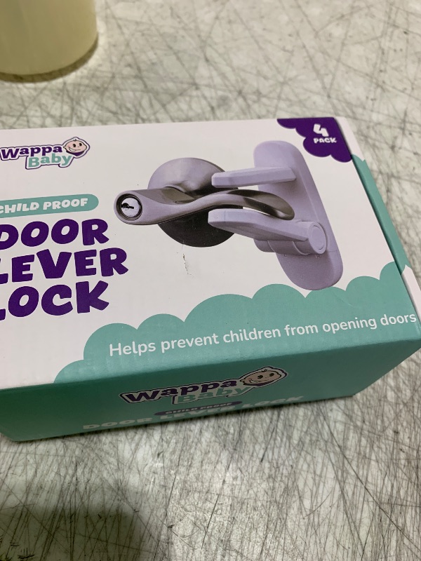 Photo 1 of Door Lever Locks (4 Pack) - Prevents Toddlers from Opening Doors - Durable ABS with 3M Adhesive - Easy One-Hand Operation for Adults, No Tools Needed