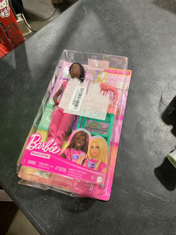 Photo 1 of Barbie Baby Doctor with Brunette Fashion Doll Wearing Pink Scrubs, 1 Baby Doll with Accessories & Furniture