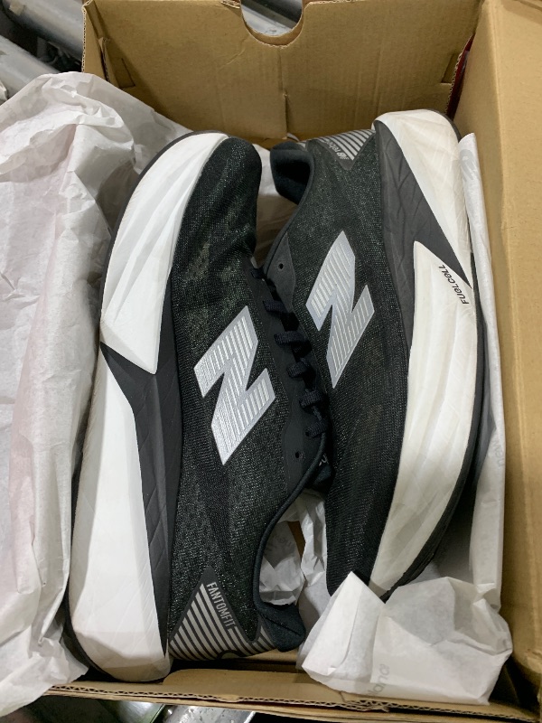 Photo 1 of New Balance Men's FuelCell Rebel V5 Running Shoe, Black/Silver Metallic/White, 11.5 Wide