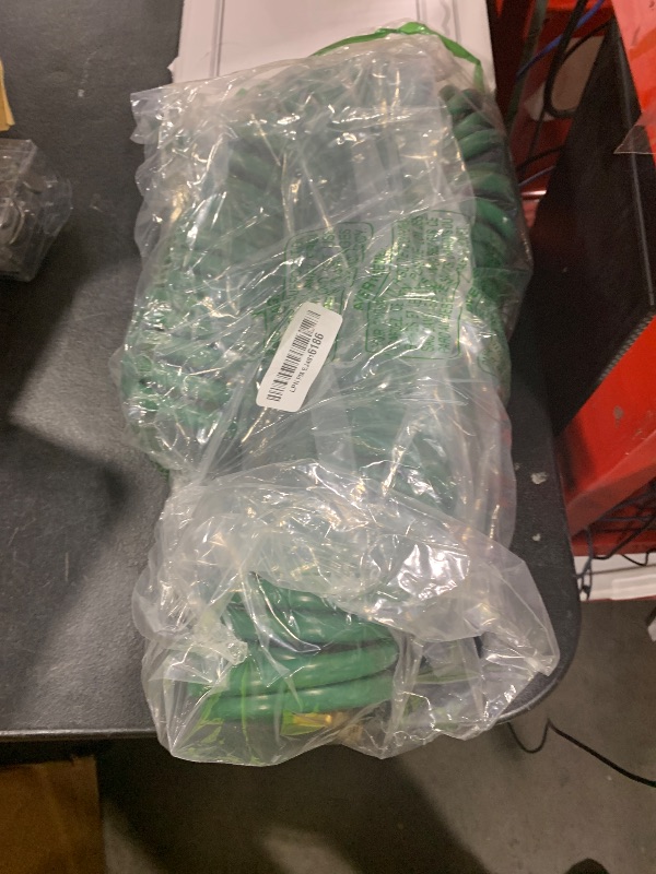 Photo 1 of AUTOMAN Coil Garden Hose 50 ft, EVA Curly Water Hose with Brass Connectors, Recoil Garden Water Hose,Includes 7-Pattern Function Sprayer,Retractable,Corrosion Resistant Garden Coil Hose.