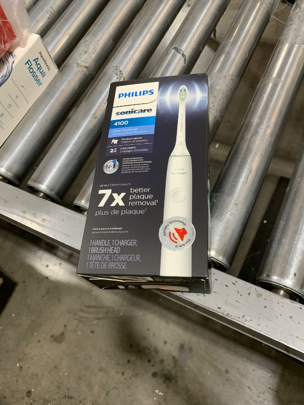 Photo 1 of Philips Sonicare 4100 Rechargeable Electric Toothbrush, with Pressure Sensor, 2 Intensity Settings, SmarTimer and QuadPacer, 14-Day Battery Life, White, Model HX3681/23