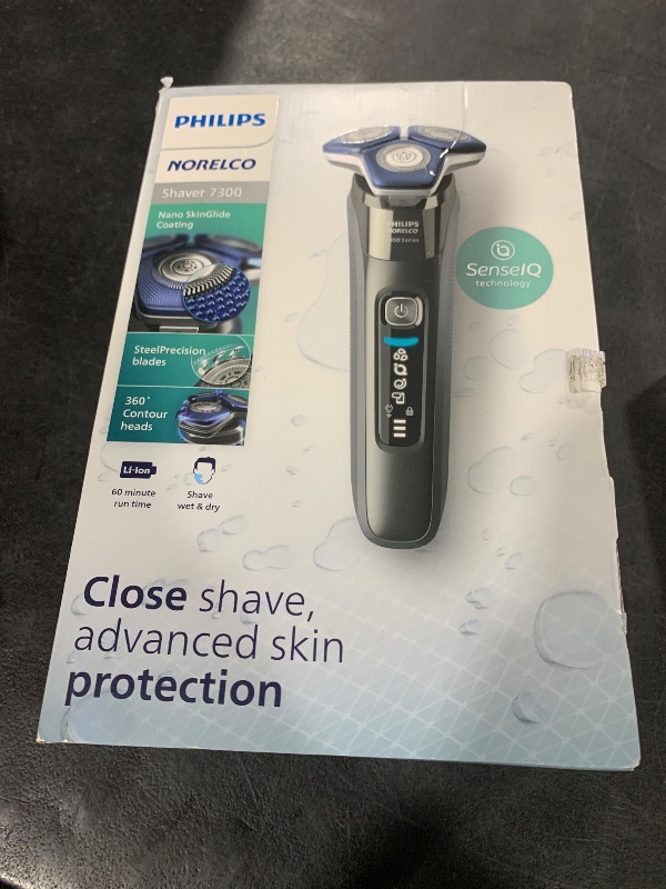 Photo 1 of Philips Norelco Shaver 7300, Rechargeable Wet & Dry Electric Shaver with SenseIQ Technology, Pop-up Trimmer, Charging Stand, Click-on Nose Trimmer, & Travel Case, S7887/92