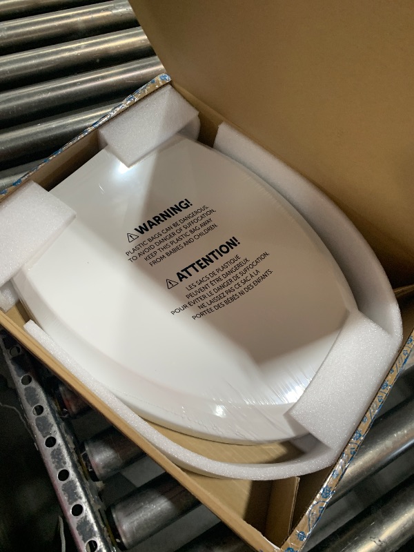 Photo 1 of Quick Flip Elongated Toilet Seat with Built-In Potty & Splash Guard for Toddler Training, Slow Close - Jool Baby