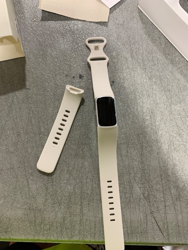 Photo 1 of Fitbit Charge 6 Fitness Tracker with Google apps, Heart Rate on Exercise Equipment, 6-Months Premium Membership Included, GPS, Health Tools and More, Porcelain/Silver, One Size (S & L Bands Included)