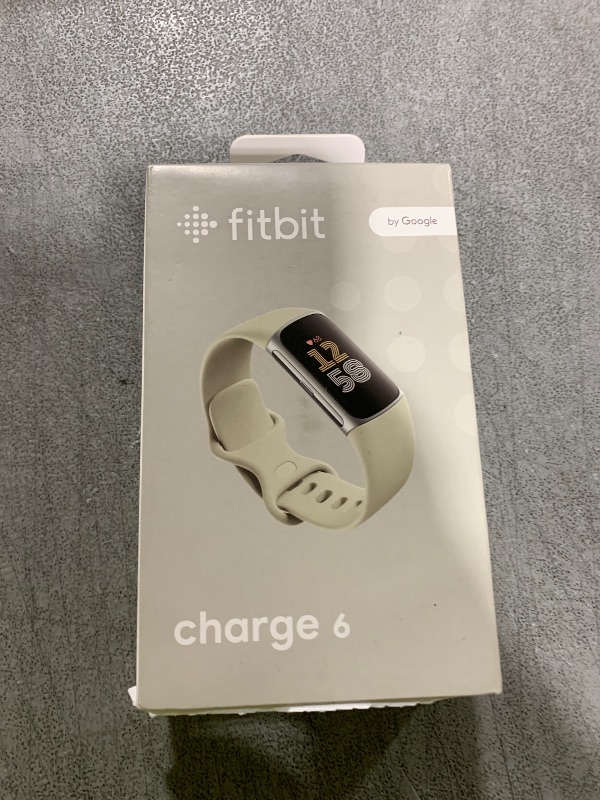 Photo 1 of Fitbit Charge 6 Fitness Tracker with Google apps, Heart Rate on Exercise Equipment, 6-Months Premium Membership Included, GPS, Health Tools and More, Porcelain/Silver, One Size (S & L Bands Included)