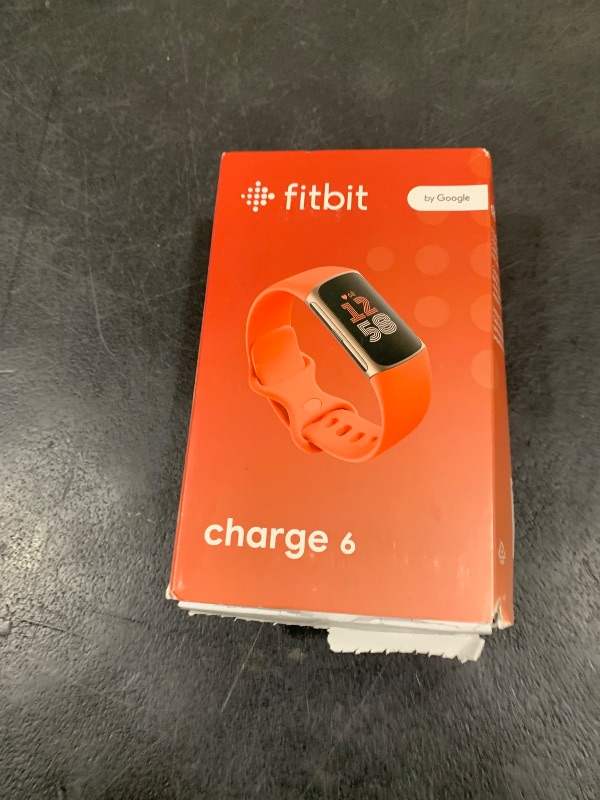 Photo 1 of Fitbit Charge 6 Fitness Tracker with Google apps, Heart Rate on Exercise Equipment, 6-Months Premium Membership Included, GPS, Health Tools and More, Gold/Coral, One Size (S & L Bands Included)
