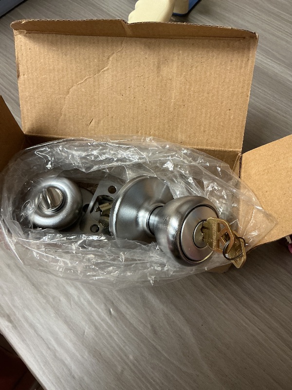 Photo 1 of Kwikset Tylo Entry Door Knob with Lock and Key, Secure Keyed Handle Exterior Doorknob, Front Entrance and Bedroom, Satin Chrome, Pick Resistant SmartKey Rekey Security