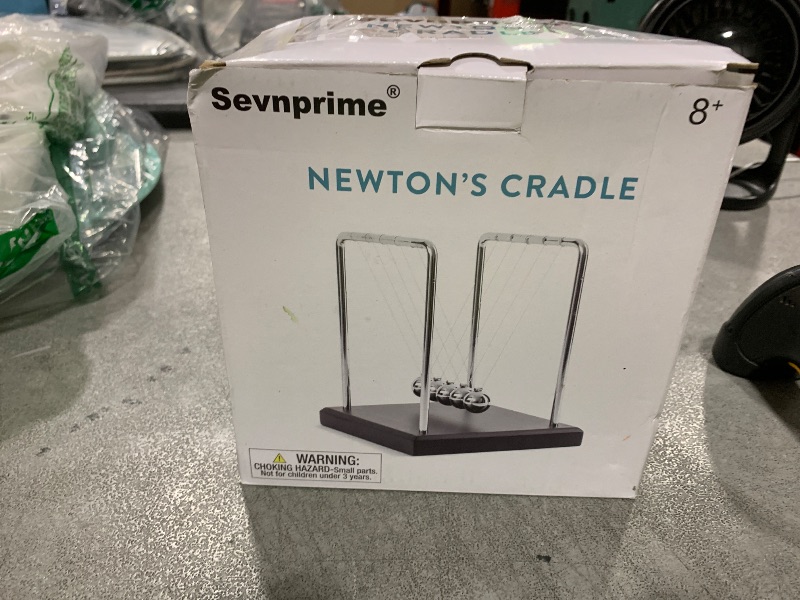 Photo 1 of SEVNPRIME 5 Large Beads Newton's Cradle Balance Balls Desk Toys Office Decorations with Black Wooden Base Desk Balance Balls Fun Science Physics Toys for Office/Bedroom/Living Room