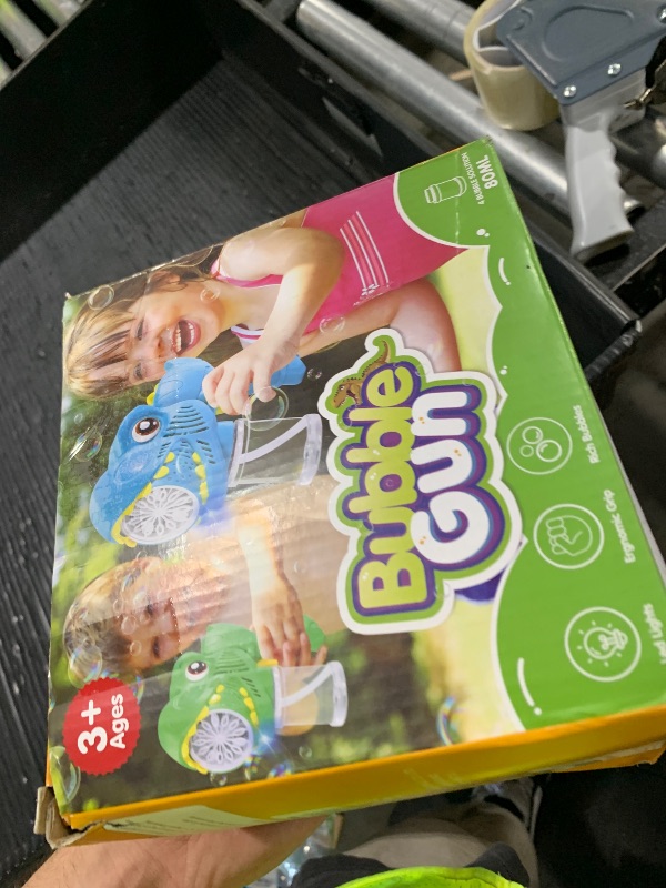 Photo 1 of Kids Bubble  2 Pack Dino Bubble Machine Gun for Toddlers with 4 Solutions Automatic 13-Hole Bubbles for Kids Blower Maker Easter Basket Essentials Stocking Stuffers Gift Party Favors for Boys Girls